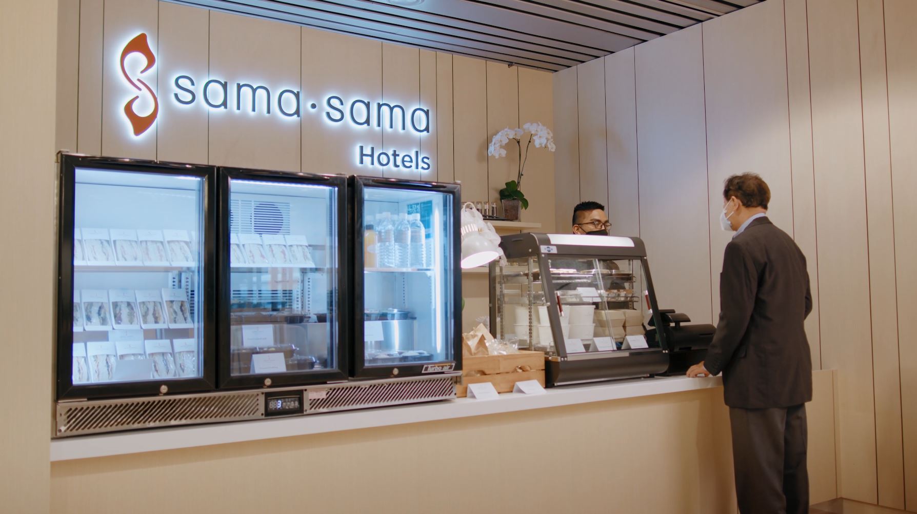 A food and beverage kiosk operated by Sama Sama Hotel at the waiting lounge.